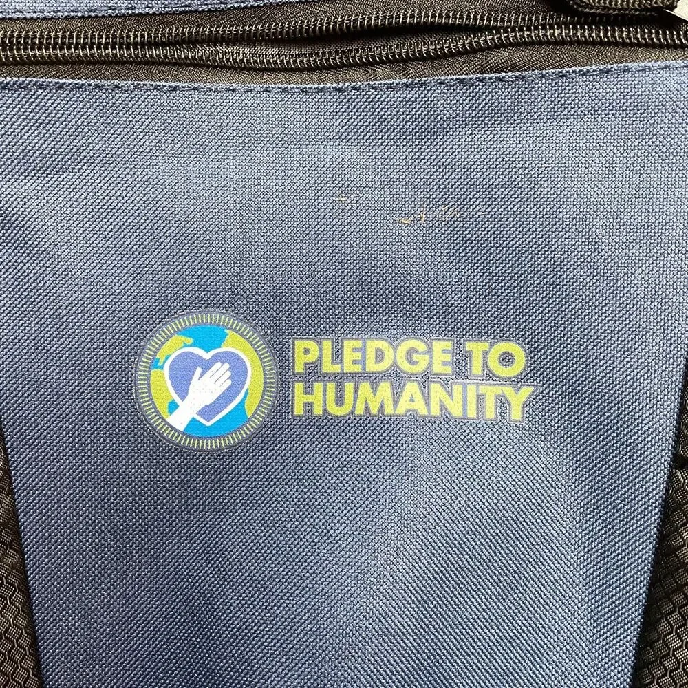 abPrime Pledge to Humanity Backpack Adult Unisex Blue Black Straps Mesh Pockets